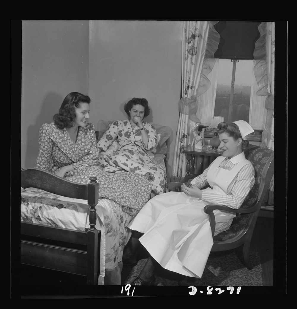 Nurse training. Given an hour's rest between rounds, Susan Petty, student nurse, is visited by her fellow nurses in her…