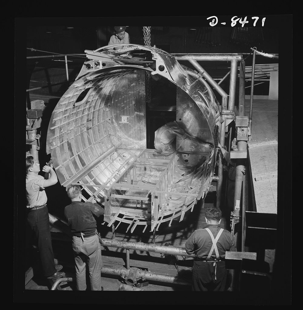 Production. B-17 heavy bomber. Completing the framework of a fuselage section for a new B-17F (Flying Fortress) bomber. The…