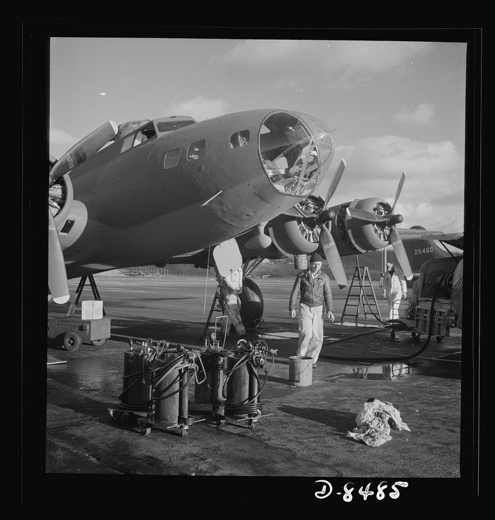 Production. B-17 heavy bomber. Lubricating and servicing a new B-17F (Flying Fortress) bomber for flight tests at the…