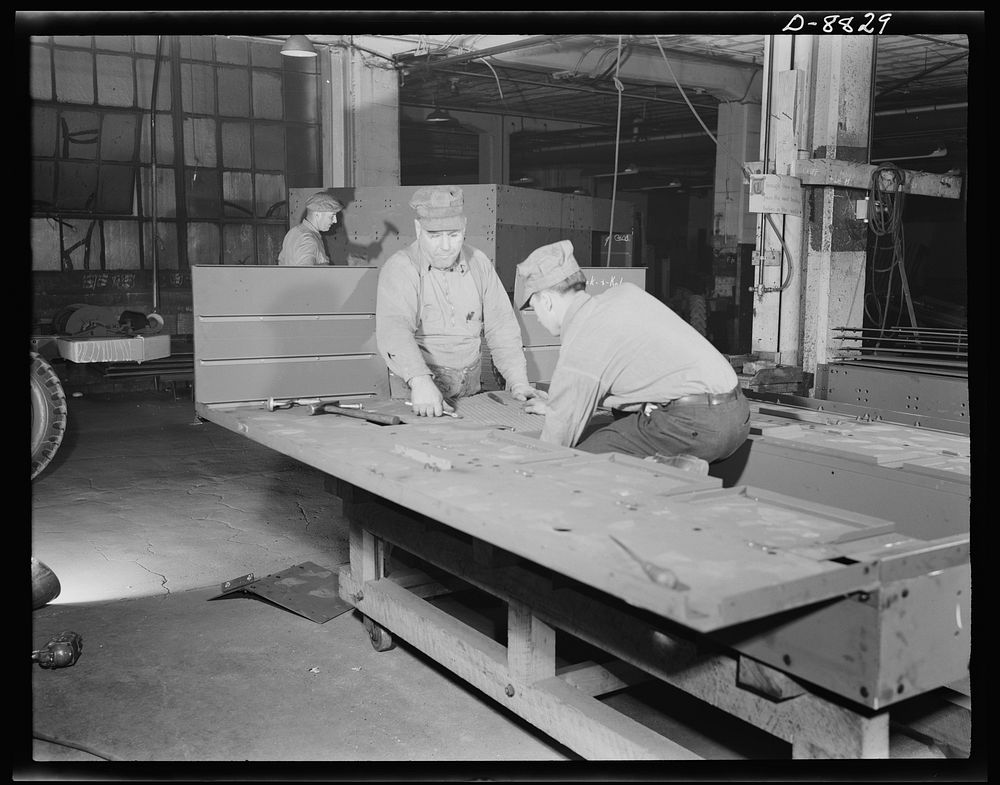 Production. Halftrac armoured cars. Attaching body parts to a halftrac scout car in the converted Eastern plant of a lock…