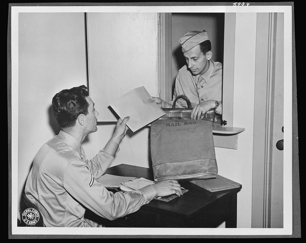 V-mail. In the V-mail room at the Pentagon building, Washington, D.C., an armed courier delivers letters for filming and…