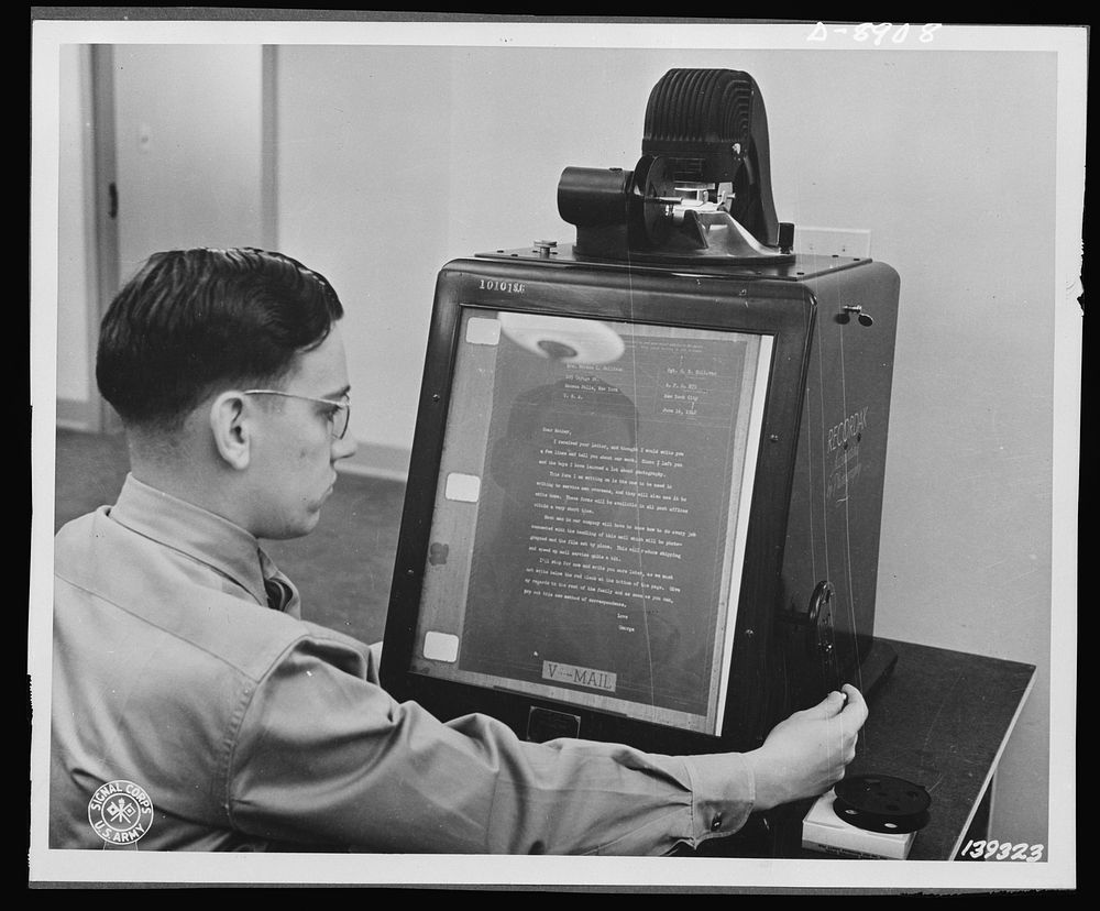 V-mail. V-mail is inspected for flaws on an enlarging "reader" at the Pentagon building, Washington, D.C.  V-mail is…