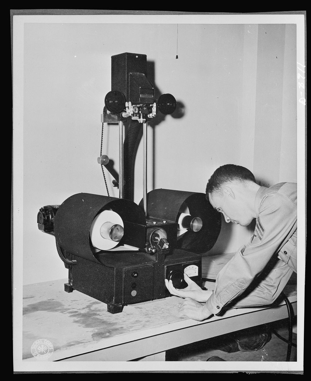 V-mail. Enlarged reproduction from V-mail microfilm are made on a continuous enlarger at the Pentagon building, Washington…