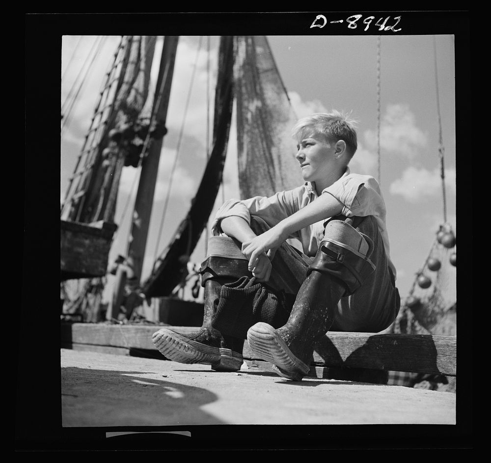 Victory food from American waters. Tomorrow's fishermen--young Gloucester boys push wagons of rosefish from the unloading…
