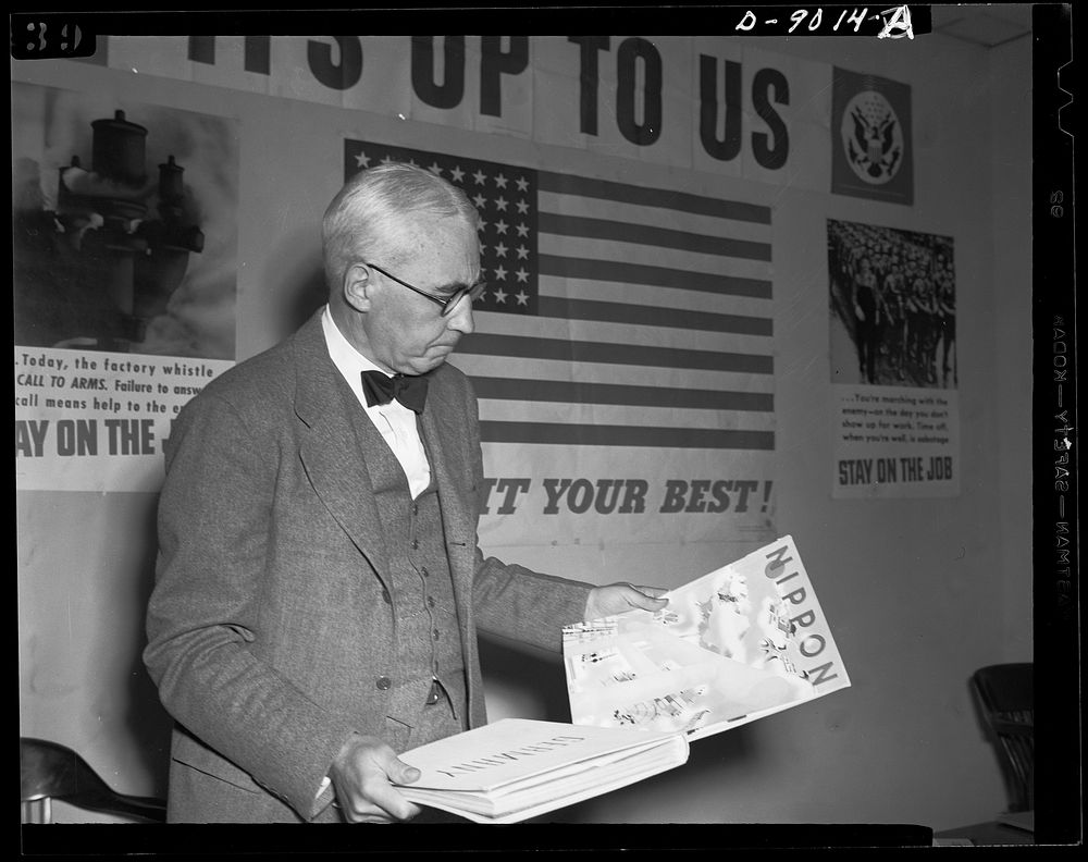 Axis propaganda. Elmer Davis, director of the Office of War Information, examines Nazi and Japanese propaganda organs which…