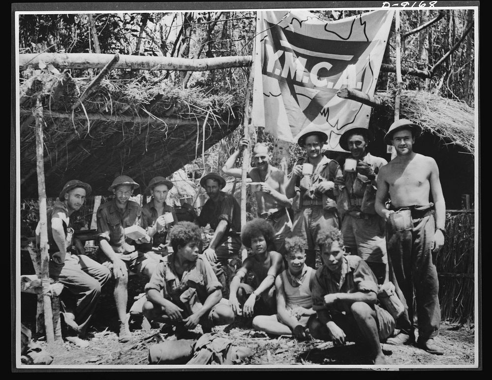 Natives aid Allied drive in New Guinea jungles. A short rest period in the New Guinea campaign. Natives and Allied troops…