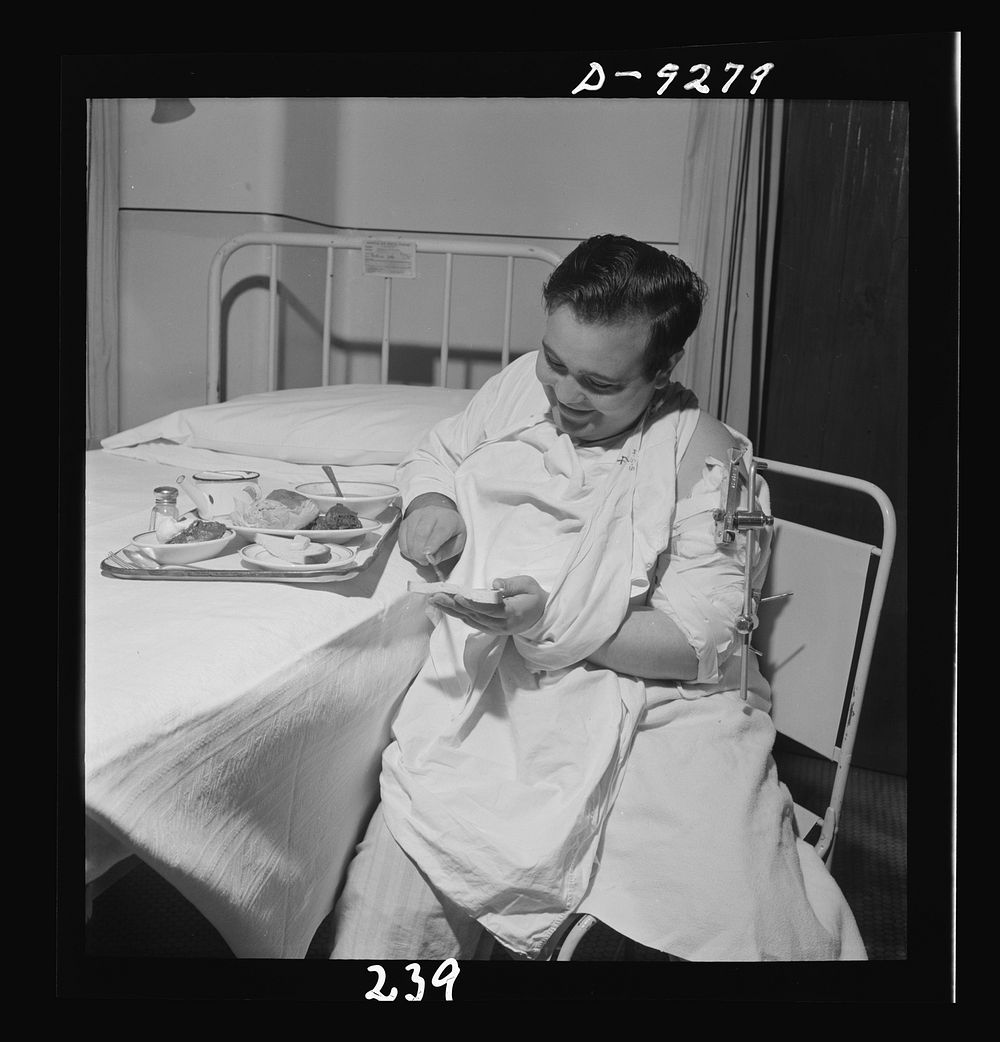 Nurse training. A patient in a Roger Anderson traction can still enjoy luncheon. Sourced from the Library of Congress.