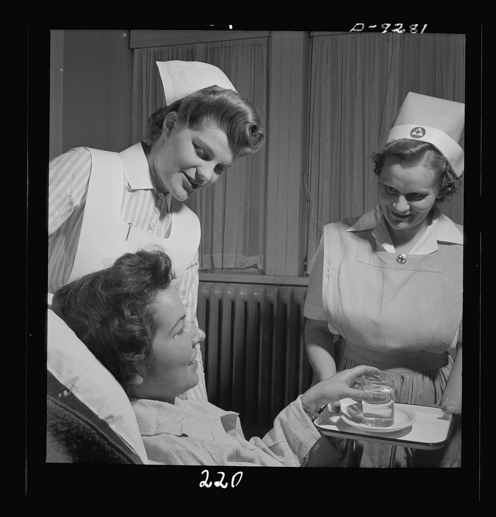 Nurse training. A nurse's aide and a student attend a convalescing patient. Sourced from the Library of Congress.