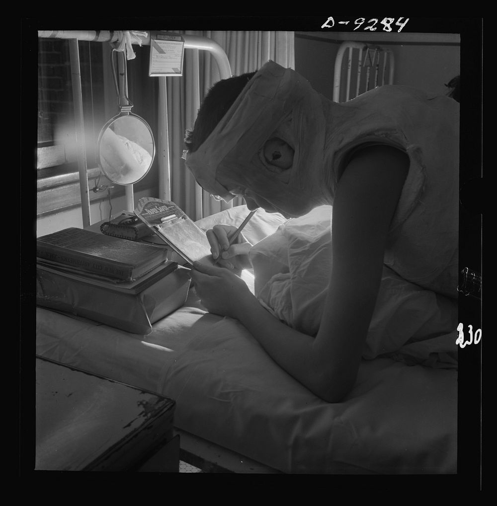 Nurse training. A patient in a Rizzer corrective jacket is able to read, write, etc., when propped at her elbows. Sourced…