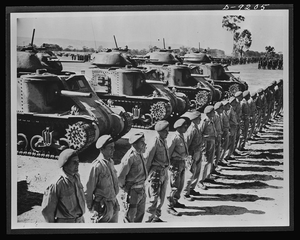 Australia in the war. American medium tanks and their Anzac crews lined up for review at a camp in Australia. Along with…