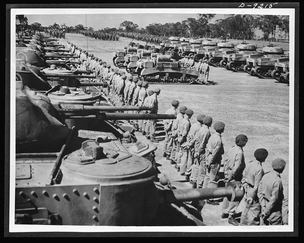 Australia in the war. American medium and light tanks and their Anzac crews lined up for review at a camp in Australia.…