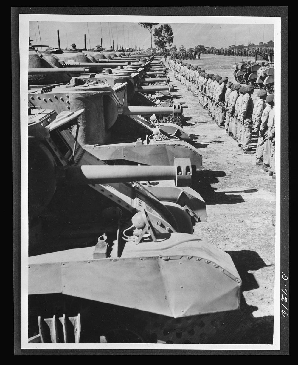 Australia in the war. An Australian armored division, equipped with American tanks, lined up for review at a camp somewhere…