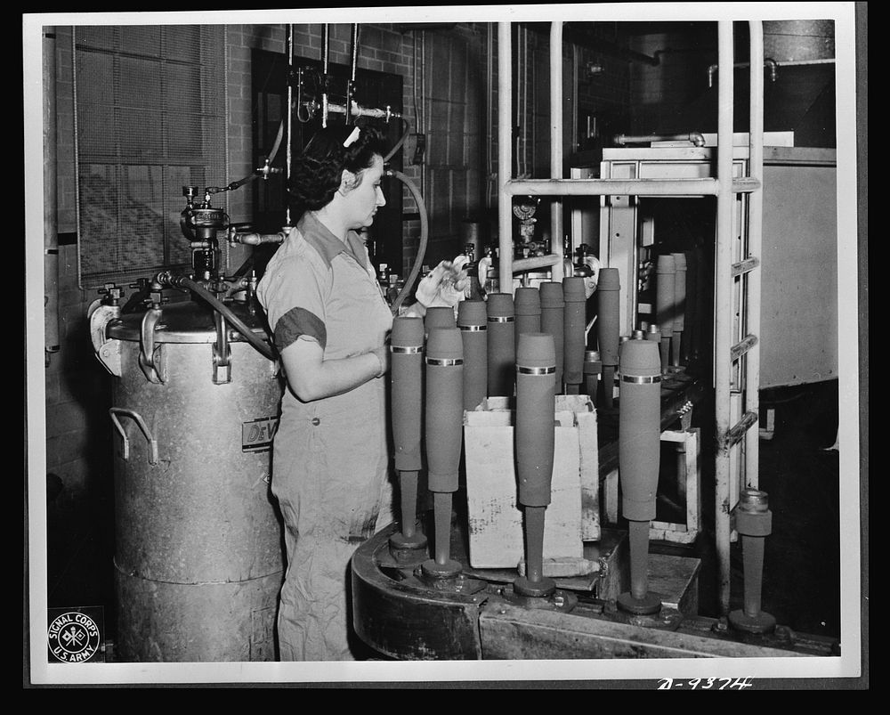 Production. Shell loading. On the "firing line" of a large Midwest loading plant, artillery shells soon to batter the Axis…
