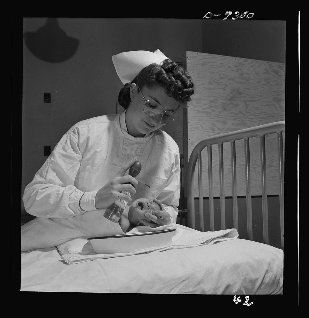 Nurse training. Care of infants is included in all nurses training. This youngster is about to get an eye irrigation. Note…
