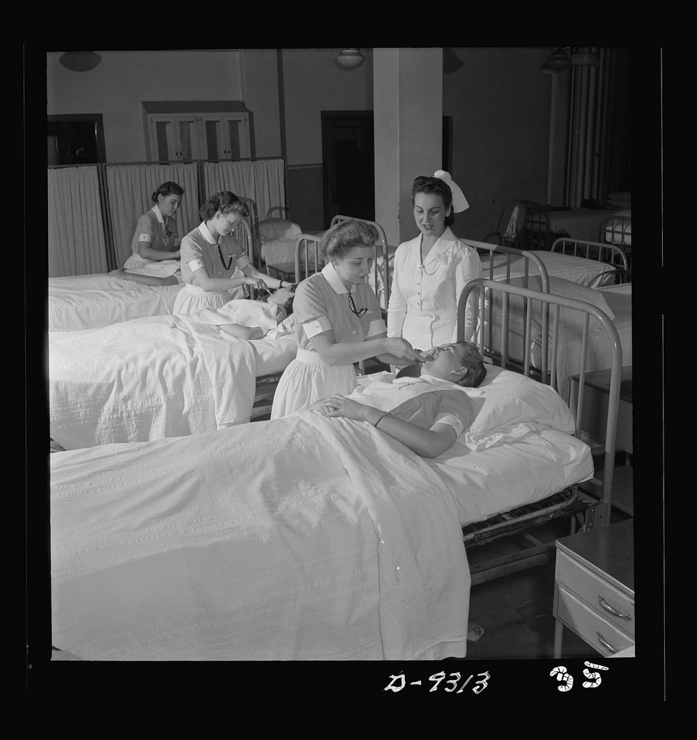 Nurse training. First-year students practice various sick-room techniques on one another. They will soon be ready for work…