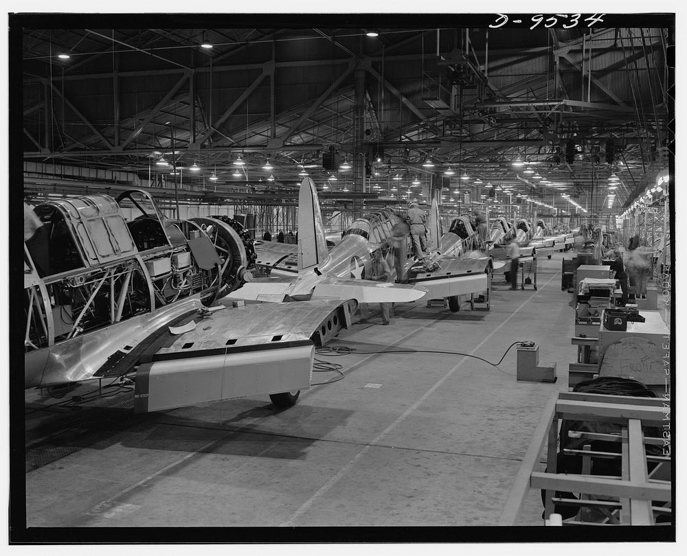 Production. BT-13A ("Valiant") basic trainers. Final "Valiant" basic trainer assembly line at Vultee's Downey, California…