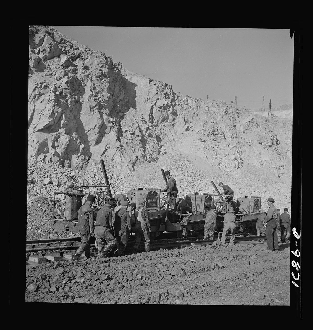Utah Copper: Bingham Mine. Track-laying crew at open-pit mining operations of Utah Copper Company, at Bingham Canyon, Utah.…