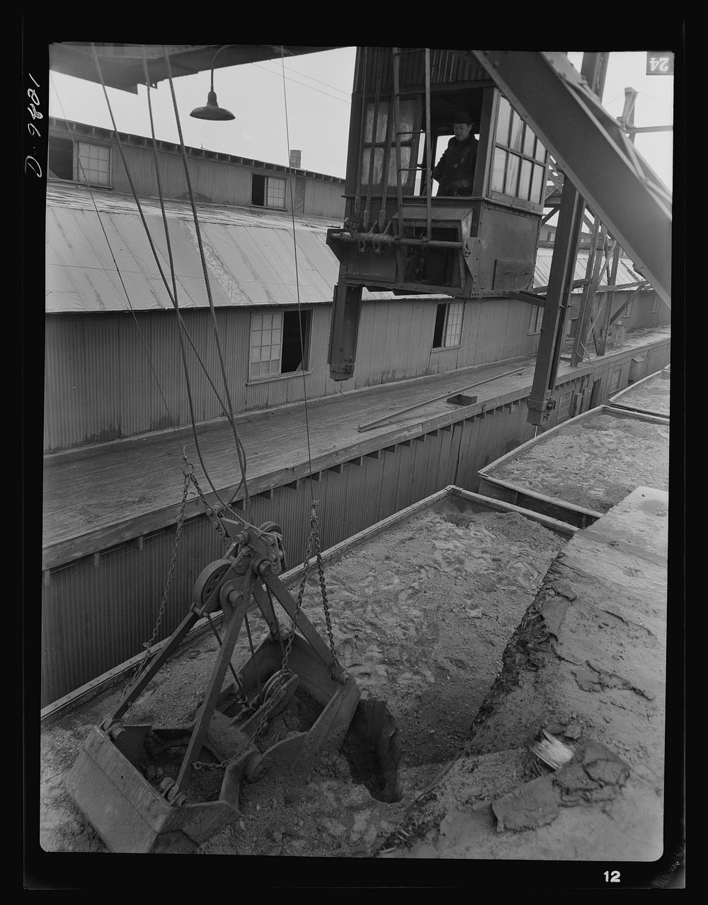 Production. Copper. Unloading copper concentrates with a clamshell bucket at the Garfield, Utah smelter of the American…