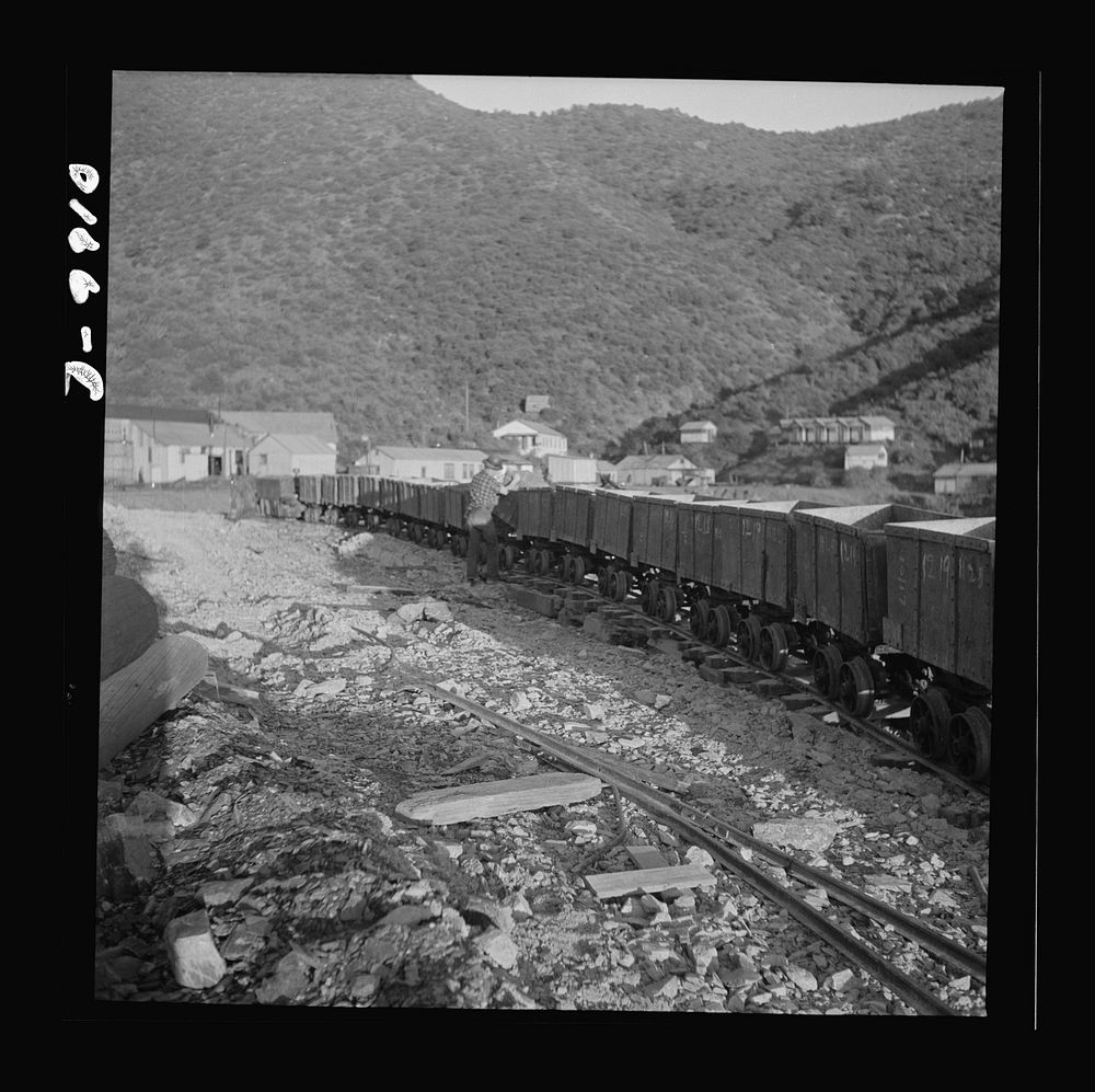 Production. Tungsten. A train of mine cars carrying tungsten ore from mines near Kingman, Arizona, to a concentrating plant…