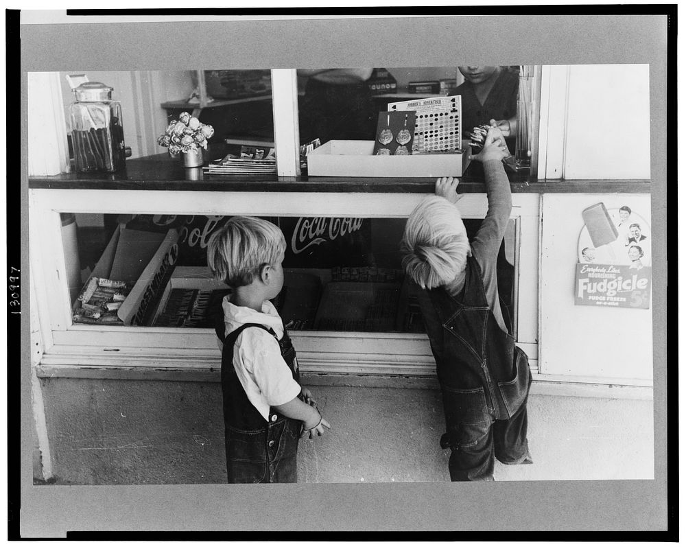 Little boys buy some candy. Caldwell, Idaho by Russell Lee