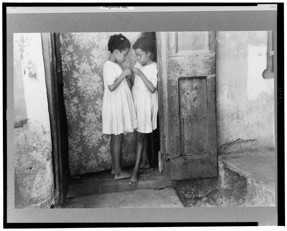 Children living in one of the substandard houses on a side street in Charlotte Amalie, St. Thomas, Virgin Islands. Sourced…
