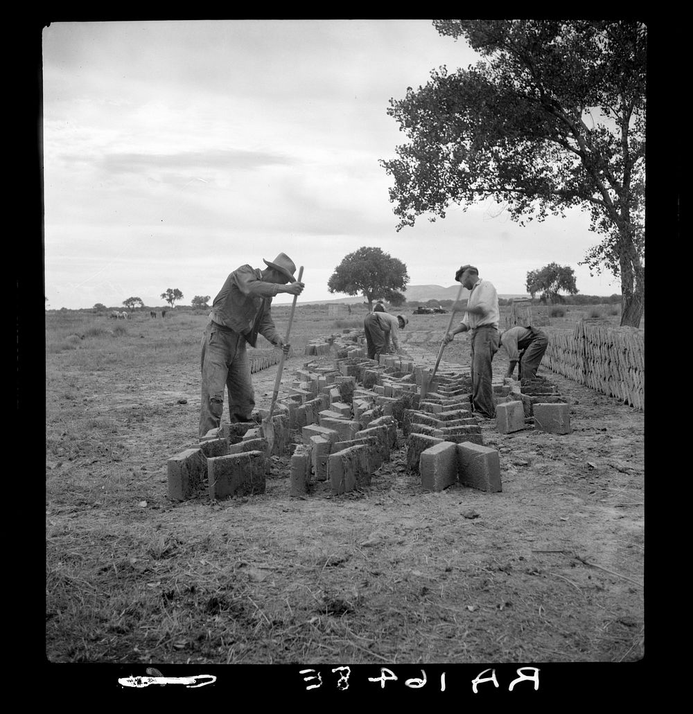 Making adobe bricks. Bosque Farms project, New Mexico. These bricks are to be used in construction of the new school…