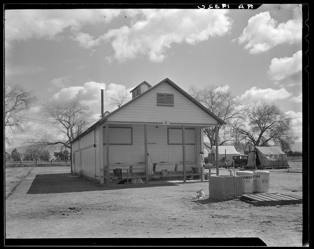 Utility units at Marysville resettlement camp. Shows sites and units, towels, hot shower, and laundry. California. Sourced…