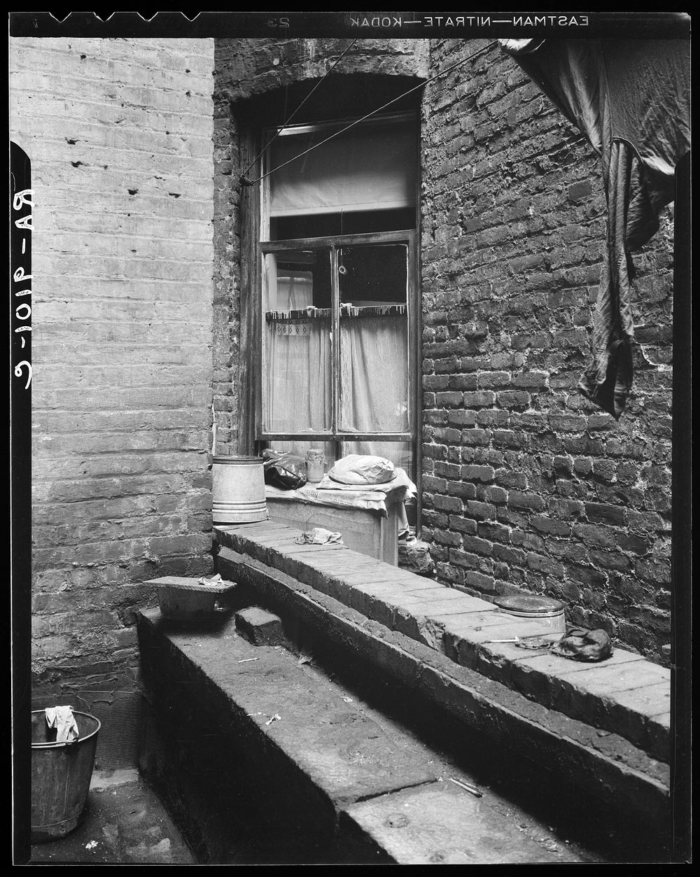 One of the rear windows, tenement dwelling of Mr. and Mrs. Jacob Solomon, 133 Aveue D, New York City. The Solomon family are…