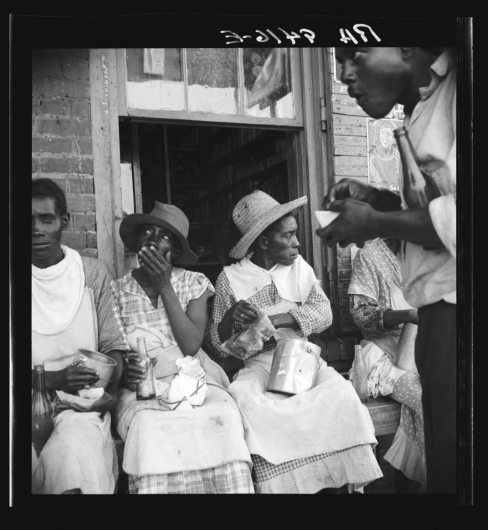 Lunchtime for the peach pickers. Muscella, Georgia by Dorothea Lange