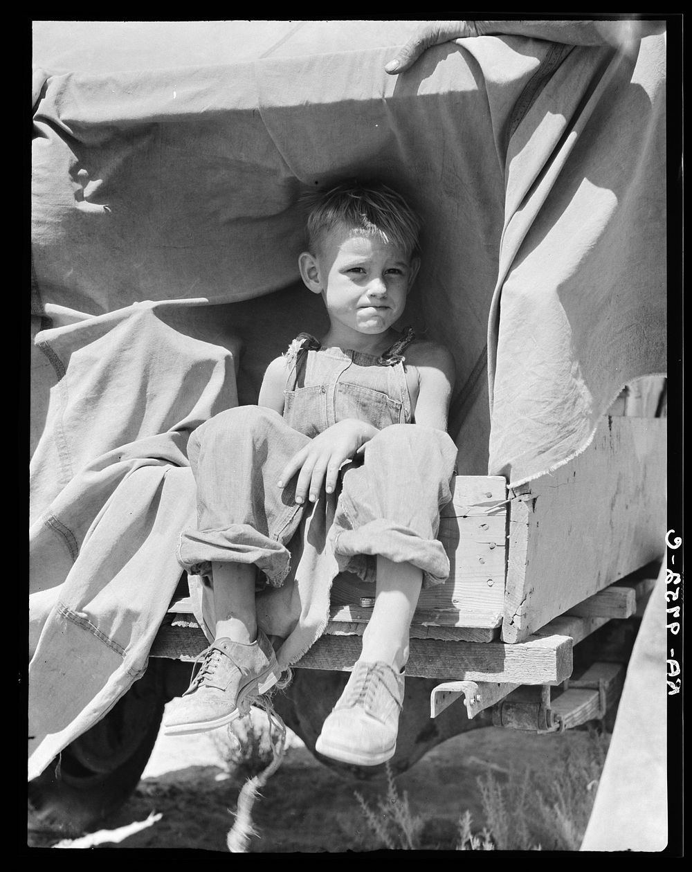 Child of an impoverished family from Iowa stranded in New Mexico by Dorothea Lange