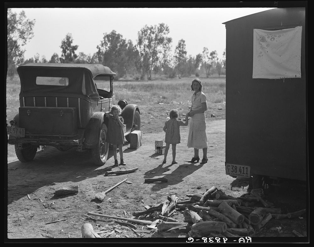 Mother of five children from Oklahoma, now picking cotton in California, near Fresno by Dorothea Lange