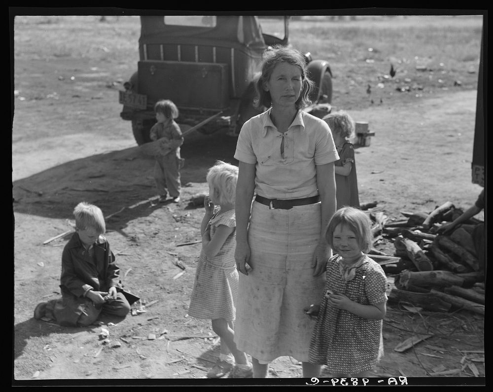 Oklahoma mother of five children, now picking cotton in California, near Fresno by Dorothea Lange