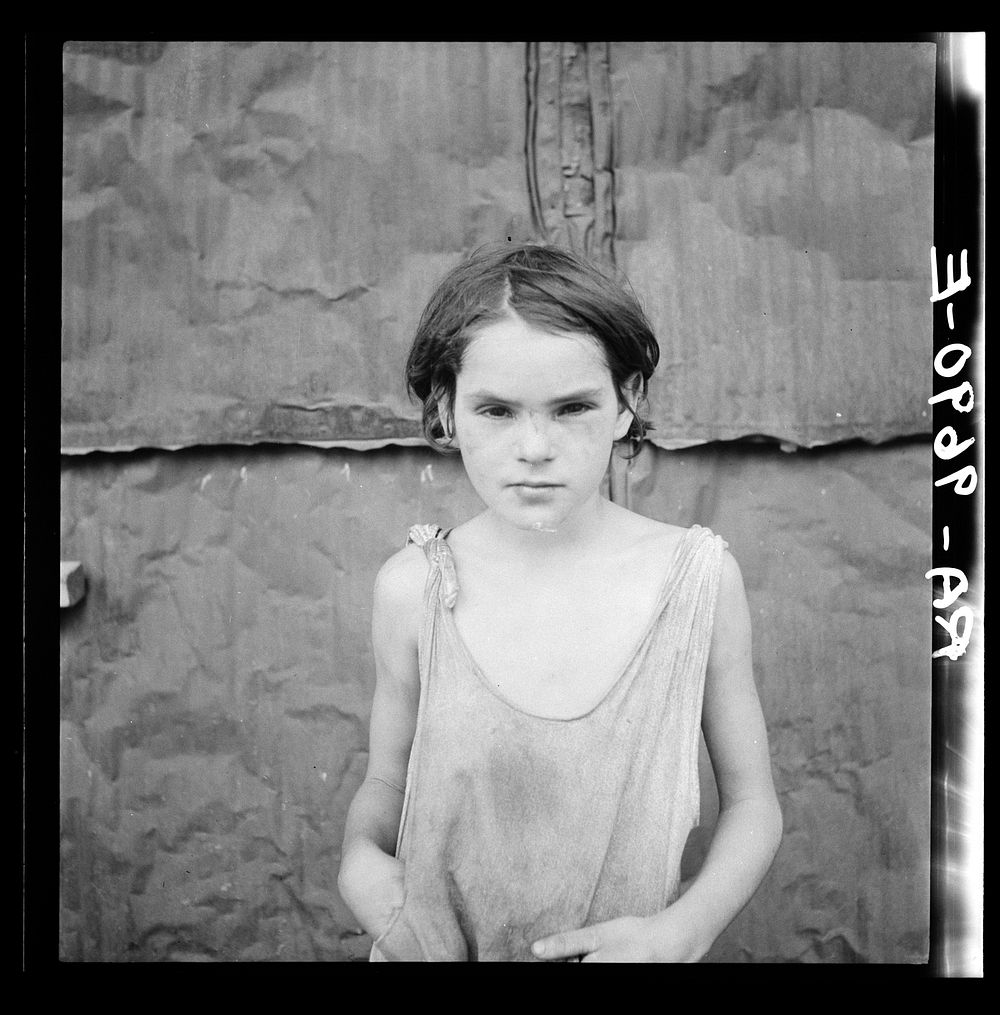 Child living in Oklahoma City shacktown by Dorothea Lange