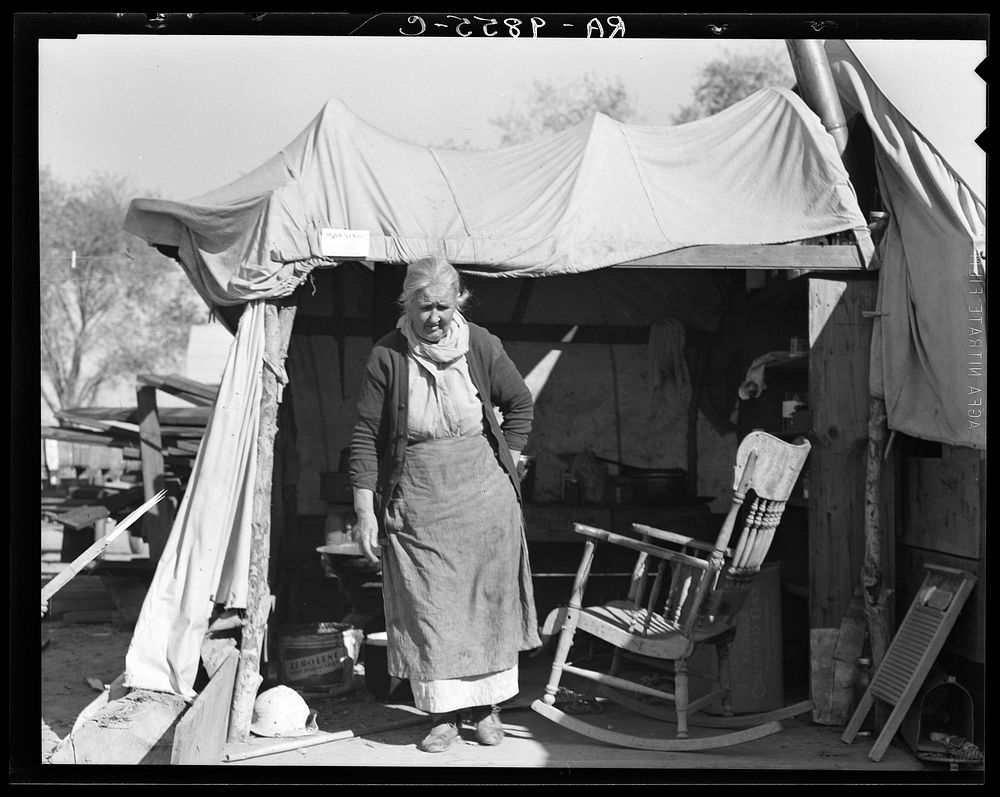Grandmother of twenty-two children from farm in Oklahoma. Now living in Kern migrant camp, California by Dorothea Lange