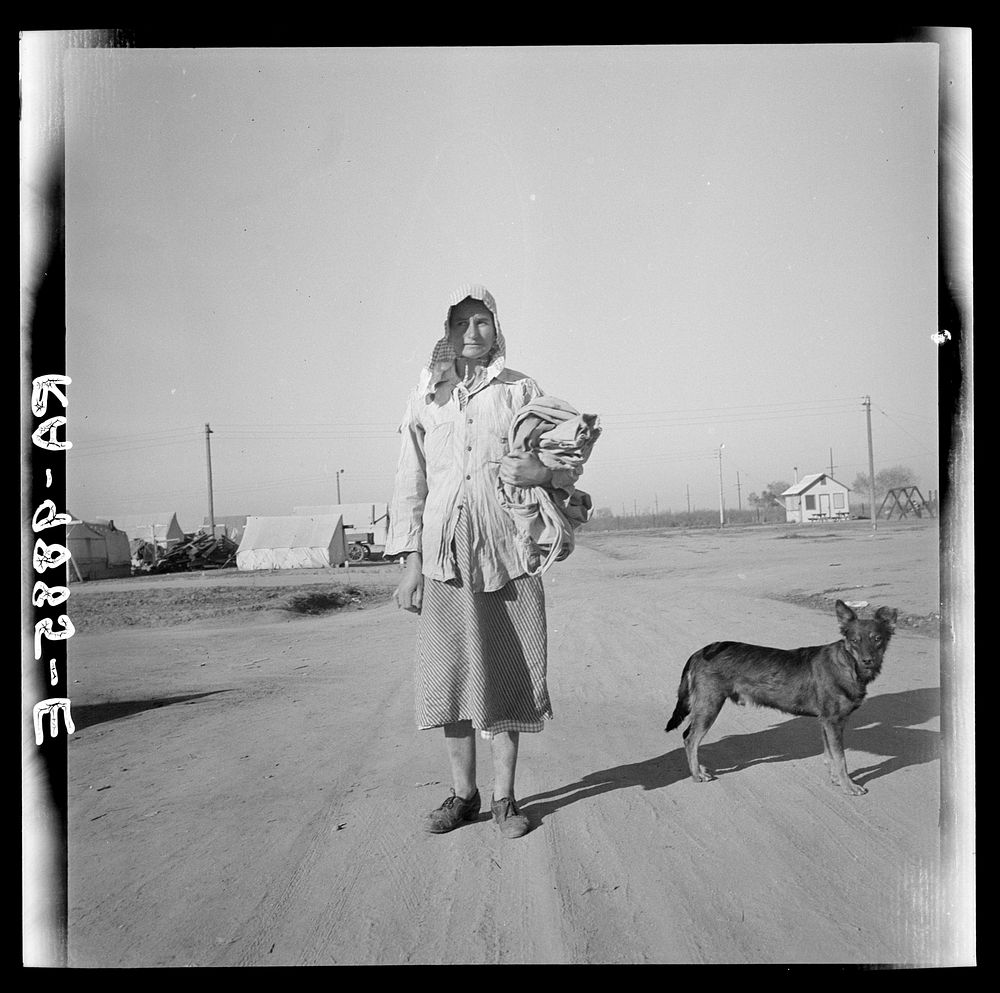 Cotton picker on her way to the cotton field. Kern migrant camp, California. Sourced from the Library of Congress.