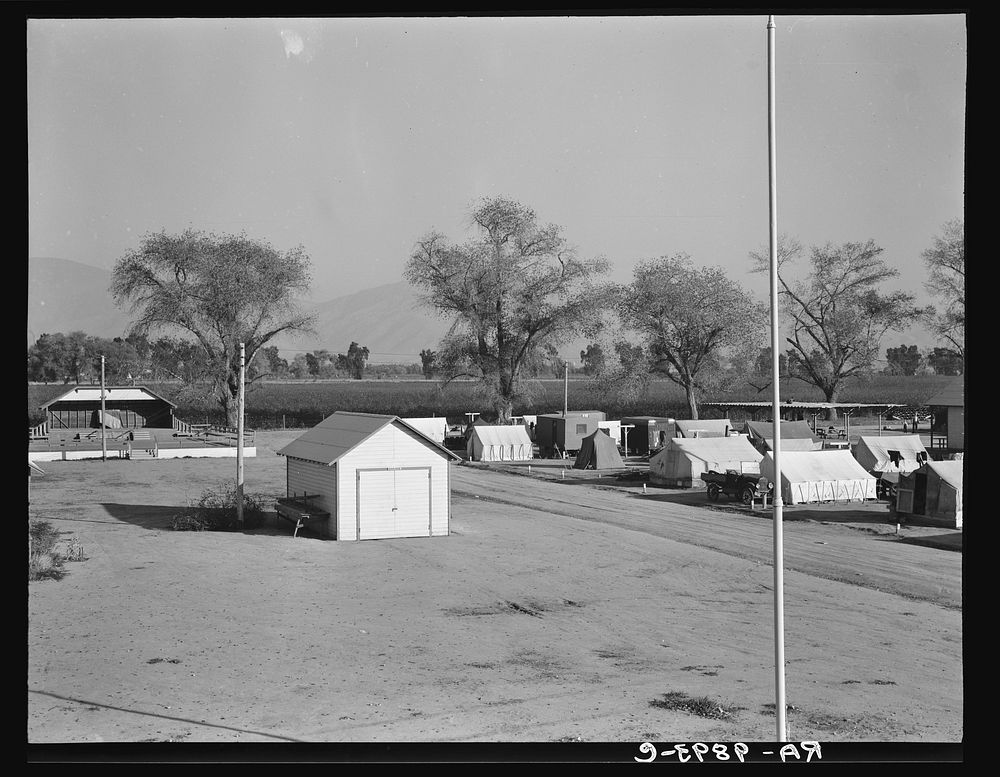 View of Kern migrant camp, community center at left. California. Sourced from the Library of Congress.