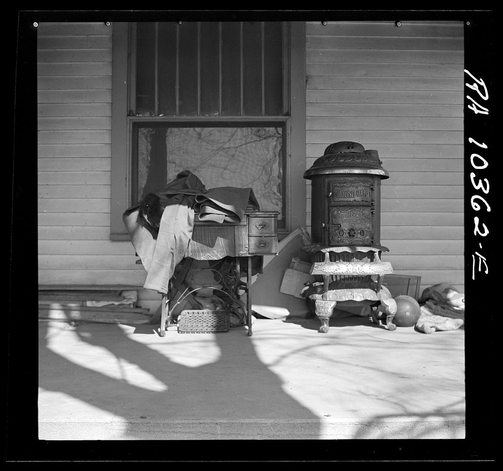 Furniture being moved out of the farmhouse of Everett Shoemaker, tenant farmer. Near Shadeland, Indiana by Russell Lee
