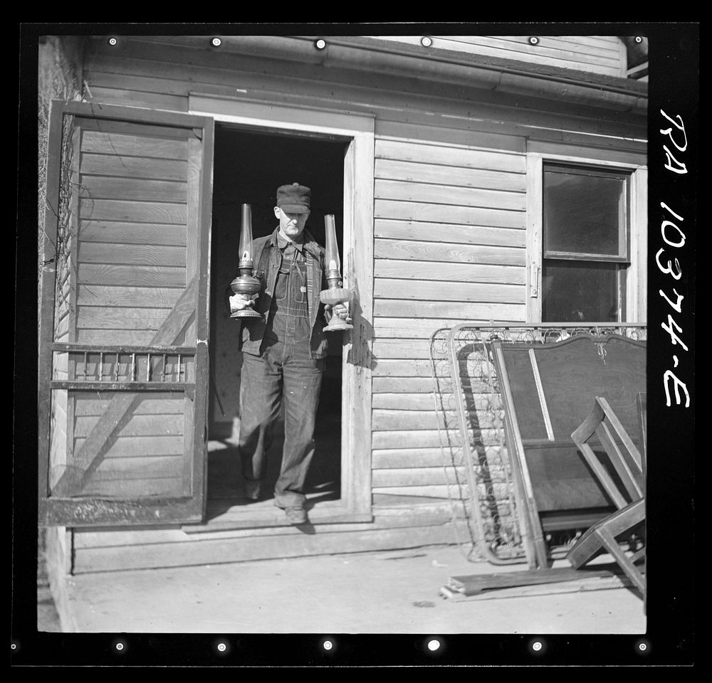 Everett Shoemaker, tenant farmer, during moving operations. He is moving to a new farm near Shadeland, Indiana by Russell Lee