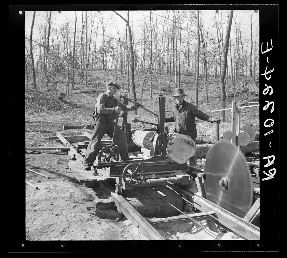 Setting the fresh log in position to be sawed. Country sawmill near Omaha, Illinois by Russell Lee