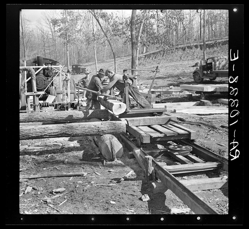 Turning the log at the country sawmill near Omaha, Illinois by Russell Lee