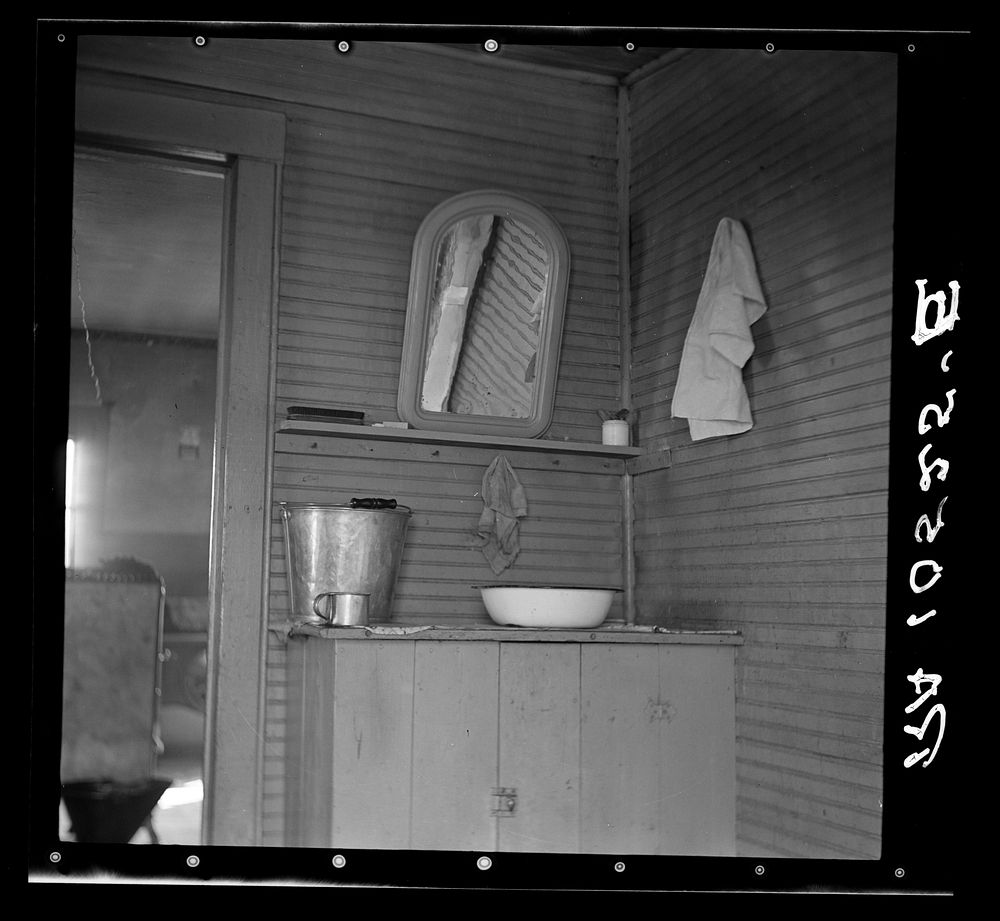 Washing facilities in the home of Elmer Johnson, hired farmhand. Near Battle Ground, Indiana. His employer has a bathroom in…