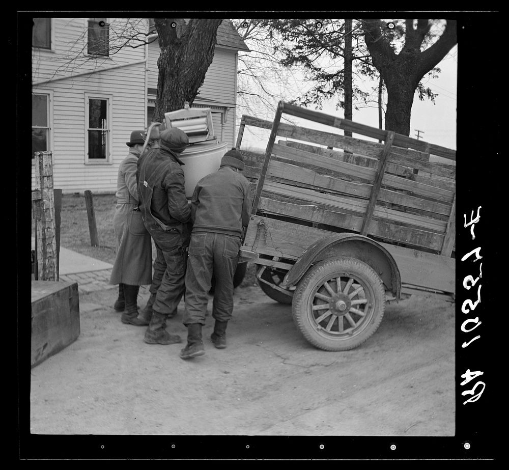 Charles Miller's household goods being moved onto the farm which he is renting northeast of Fowler, Indiana by Russell Lee