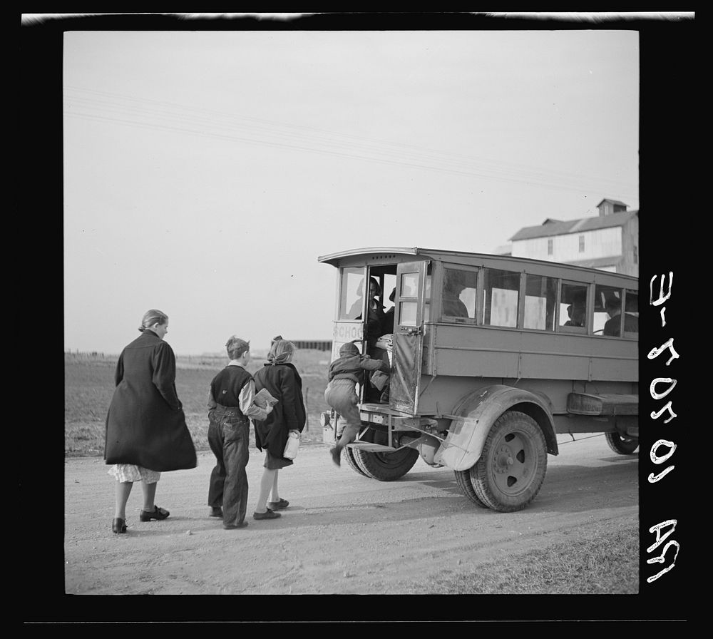 Tip Estes' children boarding a school bus near Fowler, Indiana by Russell Lee