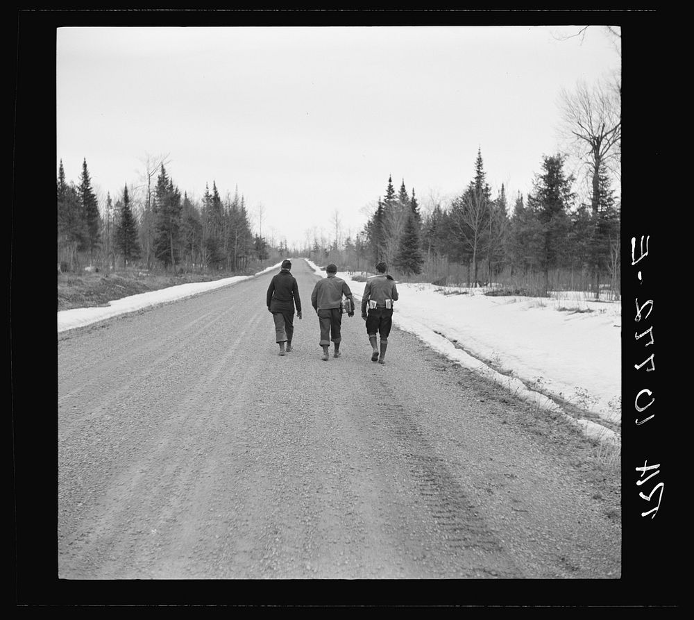 Lumberjacks walking to town after the winter work is finished. Forest County, Wisconsin by Russell Lee