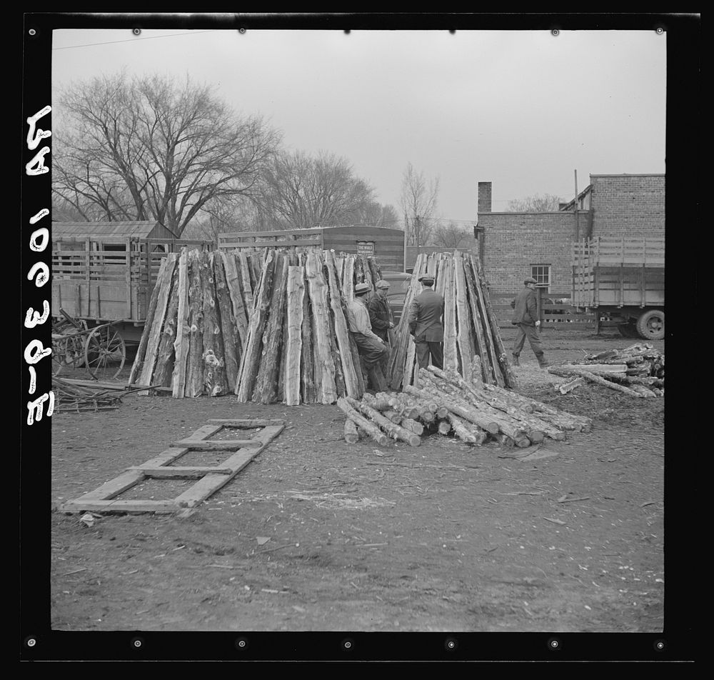 Fence posts outside the sales pavilion at Aledo, Illinois by Russell Lee