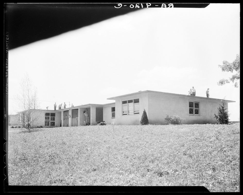 [Untitled photo, possibly related to: Hightstown, New Jersey. Type house for two families (incomplete). Will be ready for…