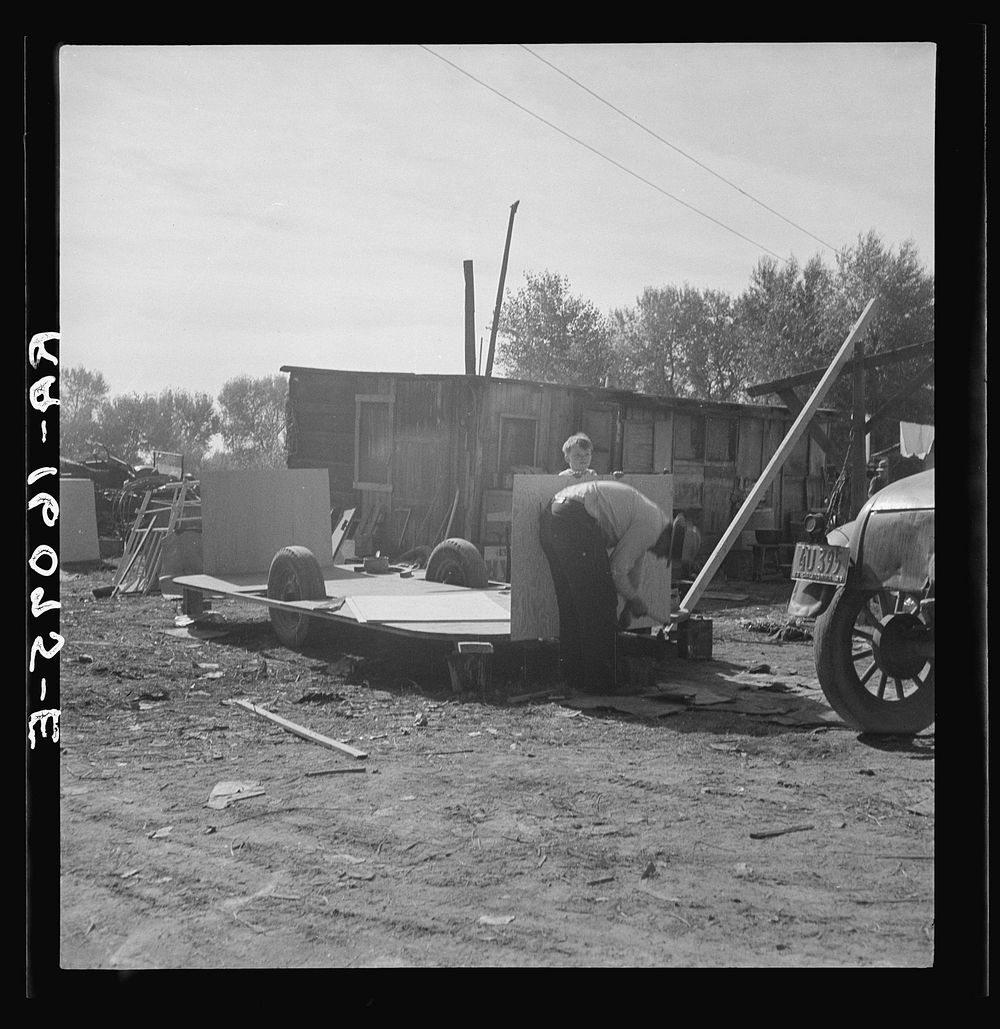 Building an auto trailer in a squatter camp. Outskirts of Bakersfield, California. Sourced from the Library of Congress.