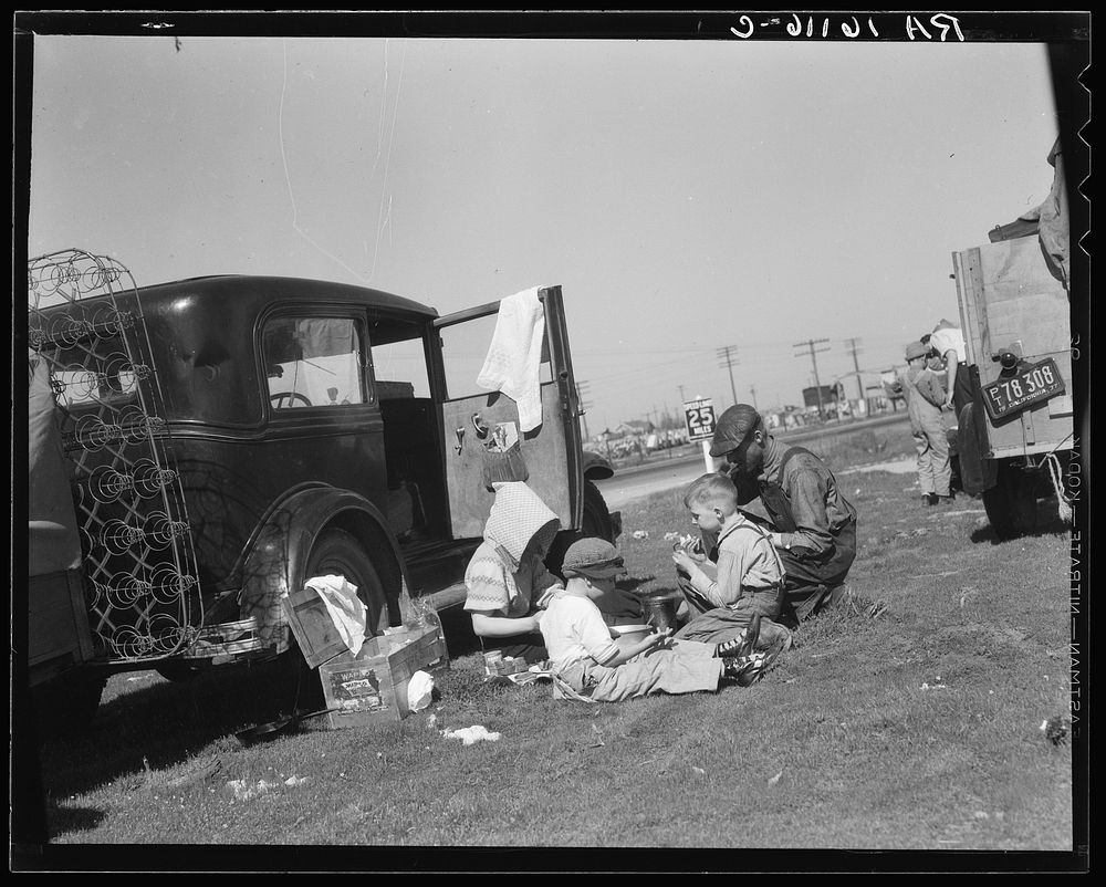 Oklahomans bound for Oregon along a highway in California. Sourced from the Library of Congress.