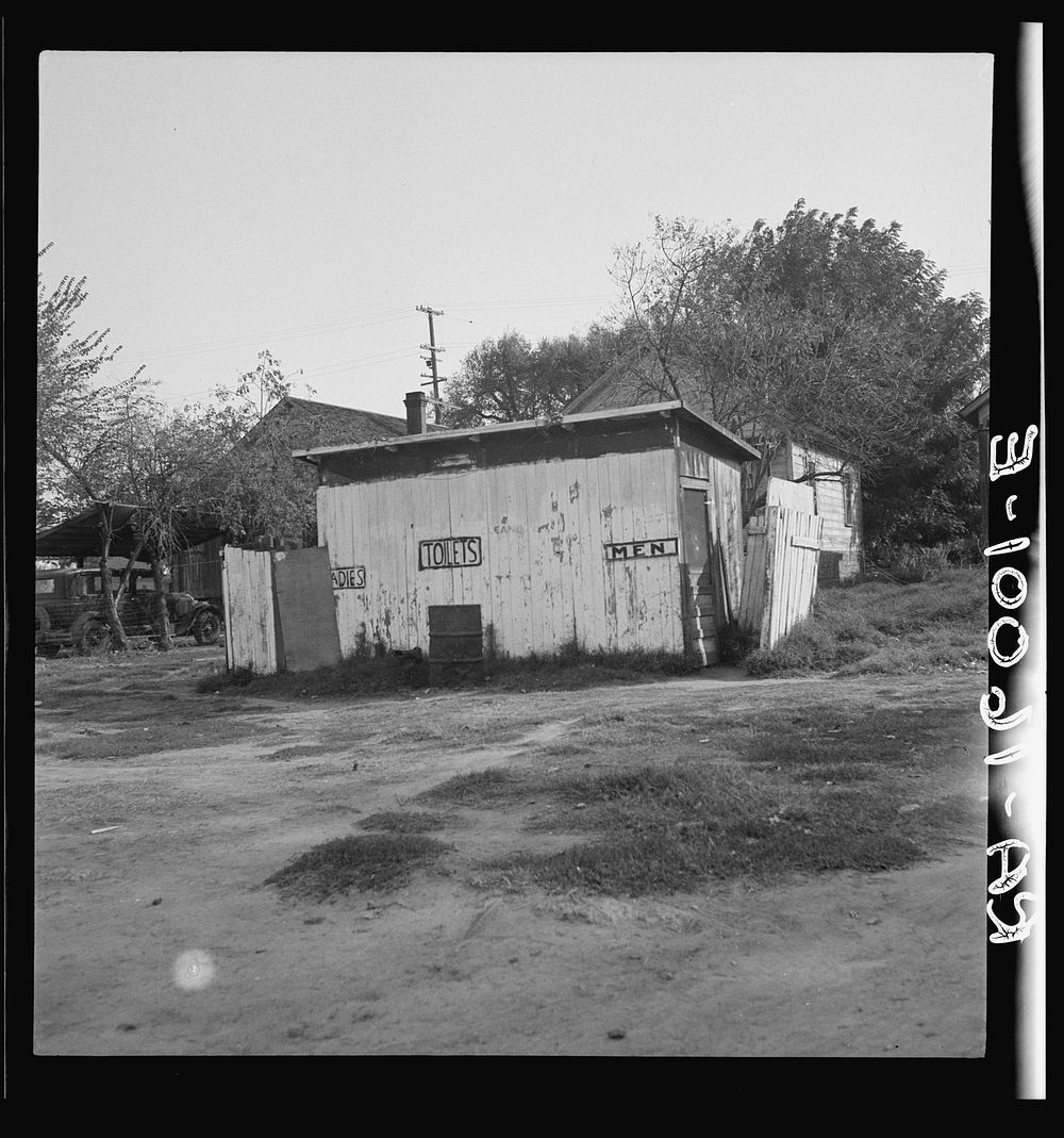Privy in cheap migratory camp. San Joaquin Valley, California. Sourced from the Library of Congress.
