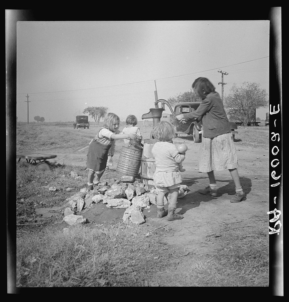 Water supply. Migratory camp for cotton pickers. San Joaquin Valley, California. American River camp. Sourced from the…